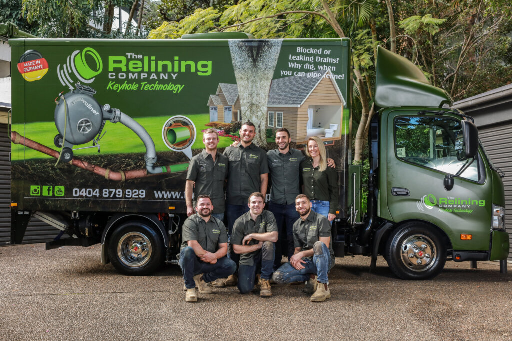 The relining company team in front of company truck